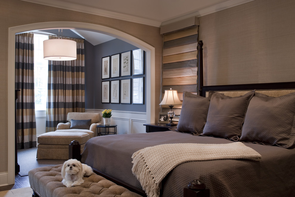 Photo of a traditional master bedroom in Chicago with brown walls.