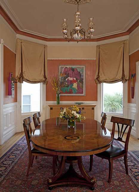 Victorian style window treatments in bronze satin fabric with tassels and swags