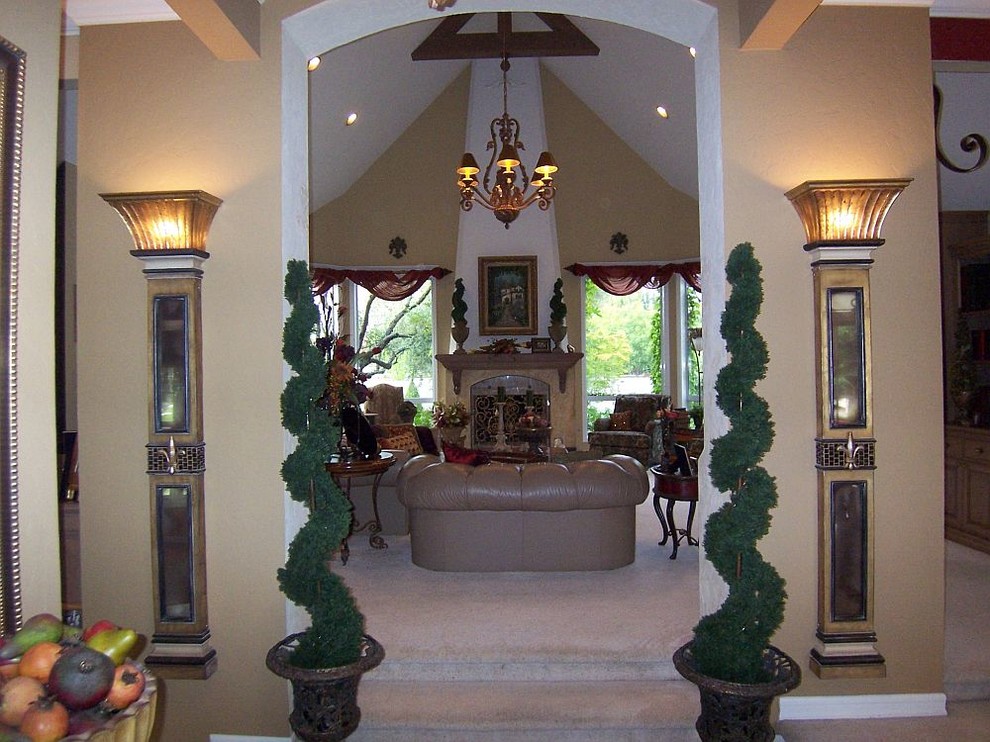 Example of a large classic carpeted entry hall design with a black front door