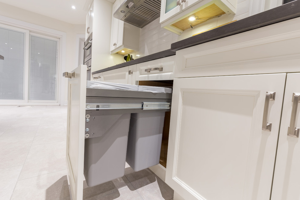 Example of a transitional kitchen design in Toronto