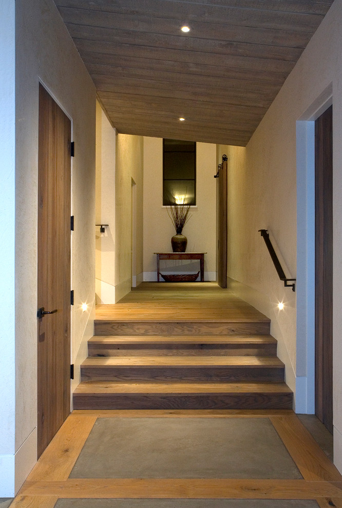 Inspiration for a rustic concrete floor entry hall remodel