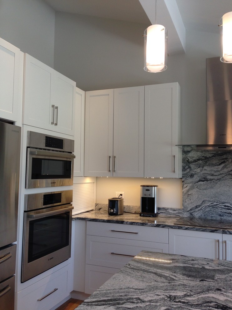 Inspiration for a mid-sized transitional u-shaped kitchen in Providence with shaker cabinets, white cabinets and with island.