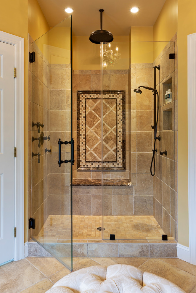 Photo of a mid-sized country master bathroom with shaker cabinets, dark wood cabinets, a freestanding tub, an alcove shower, a one-piece toilet, beige tile, yellow walls, an undermount sink, beige floor, a hinged shower door and multi-coloured benchtops.