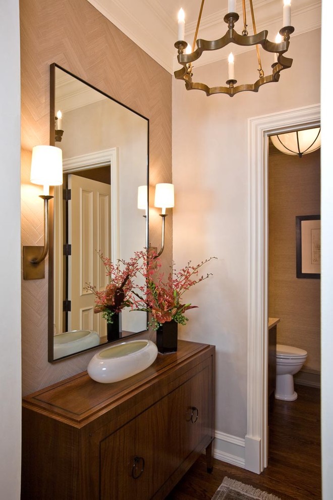 Photo of a mid-sized transitional 3/4 bathroom in San Francisco with an undermount sink, flat-panel cabinets, medium wood cabinets, limestone benchtops, a one-piece toilet, beige tile, stone slab, brown walls and medium hardwood floors.