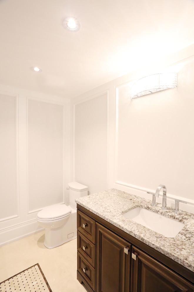 Example of a transitional home design design in Toronto