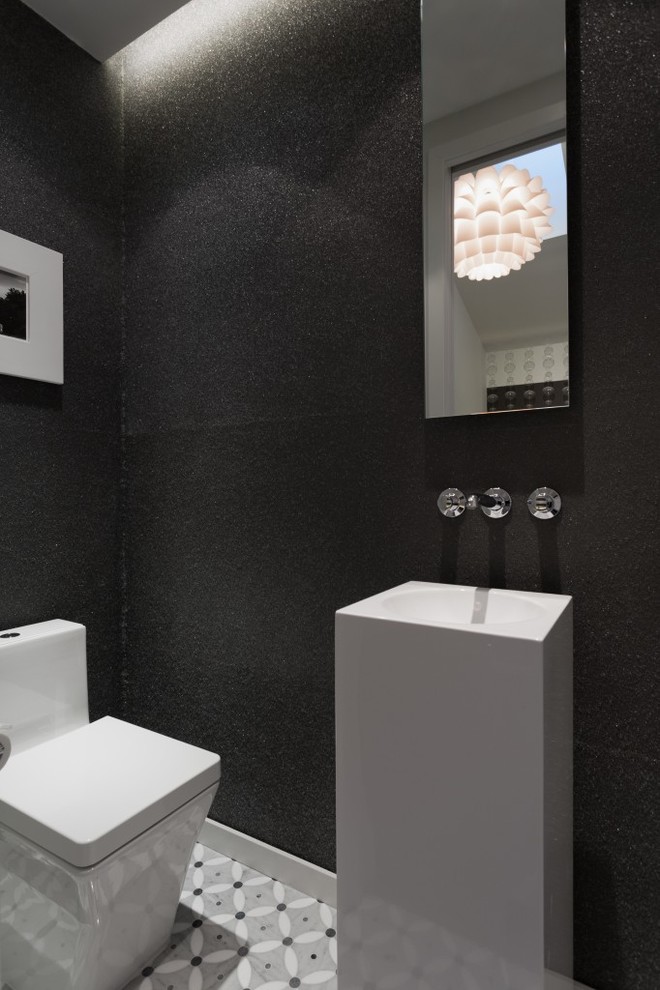 Design ideas for a small contemporary powder room in San Francisco with a one-piece toilet, black walls, mosaic tile floors, a pedestal sink and grey floor.