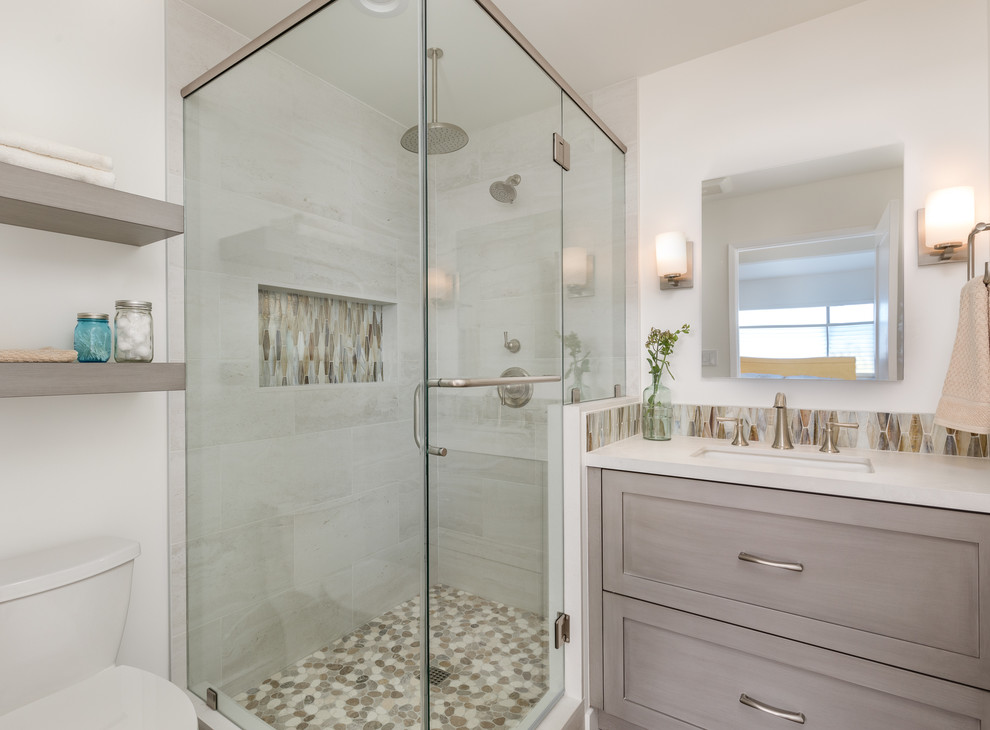 Photo of a mid-sized asian bathroom in Los Angeles with shaker cabinets, porcelain floors, an undermount sink, grey cabinets, a corner shower, brown tile, porcelain tile, concrete benchtops, brown floor, a hinged shower door and white benchtops.