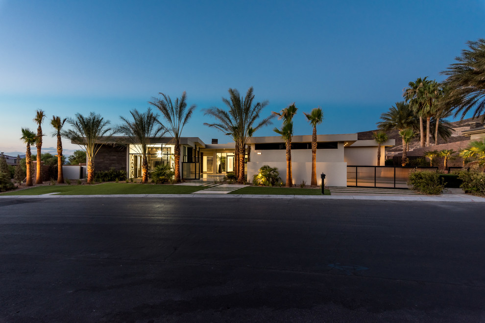 Design ideas for a large contemporary one-storey stucco white house exterior in Las Vegas with a flat roof.