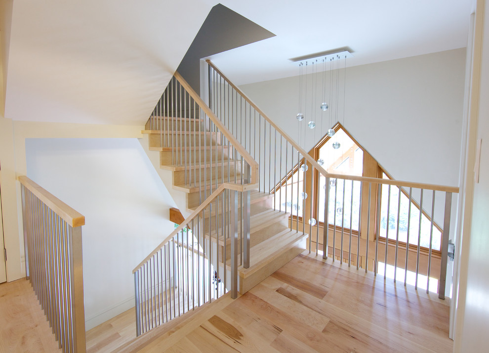 Inspiration for a contemporary wood l-shaped staircase in Vancouver with wood risers.
