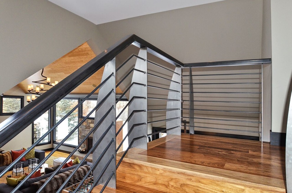 Photo of a mid-sized modern wood straight staircase in Denver with wood risers.