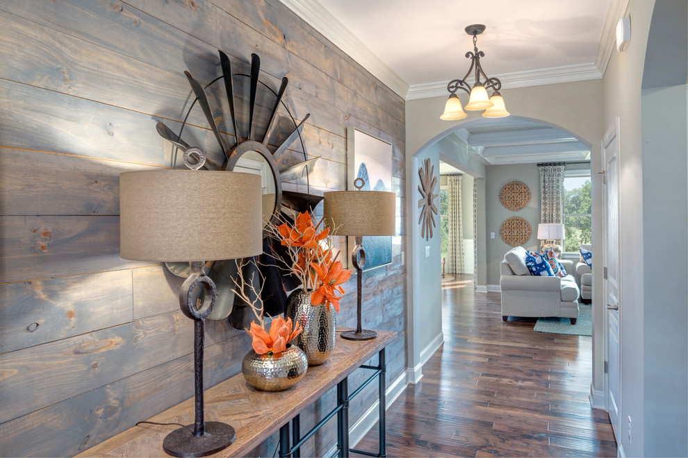 Photo of a transitional entry hall in Atlanta with grey walls and medium hardwood floors.