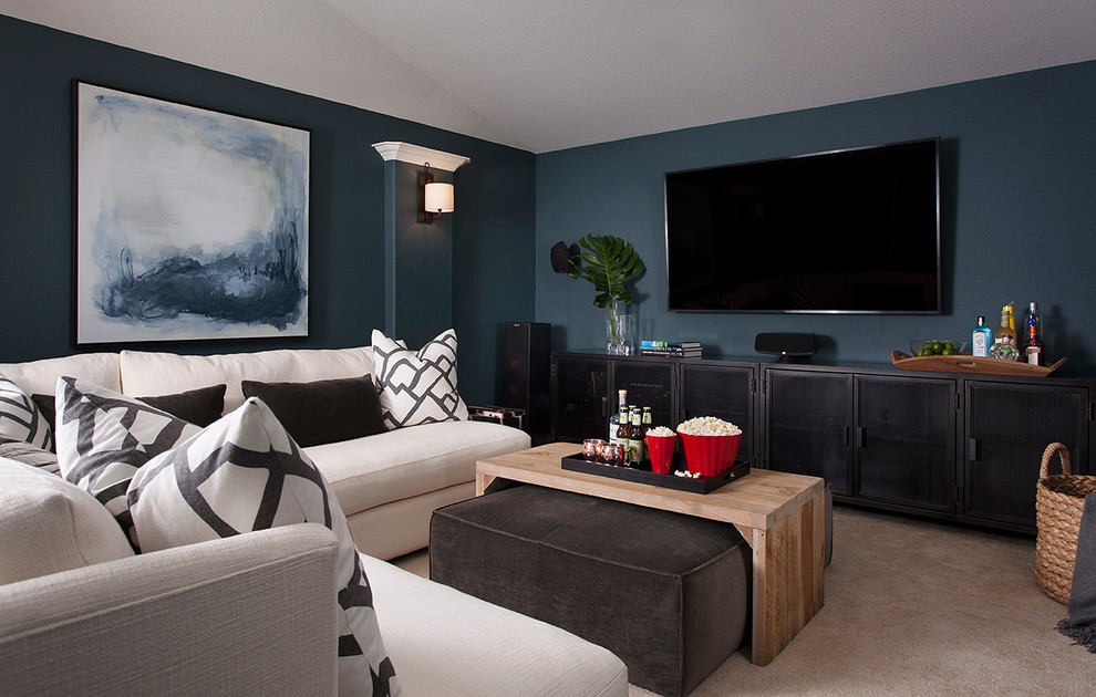 Mid-sized transitional home theatre in Austin with blue walls, carpet and a wall-mounted tv.