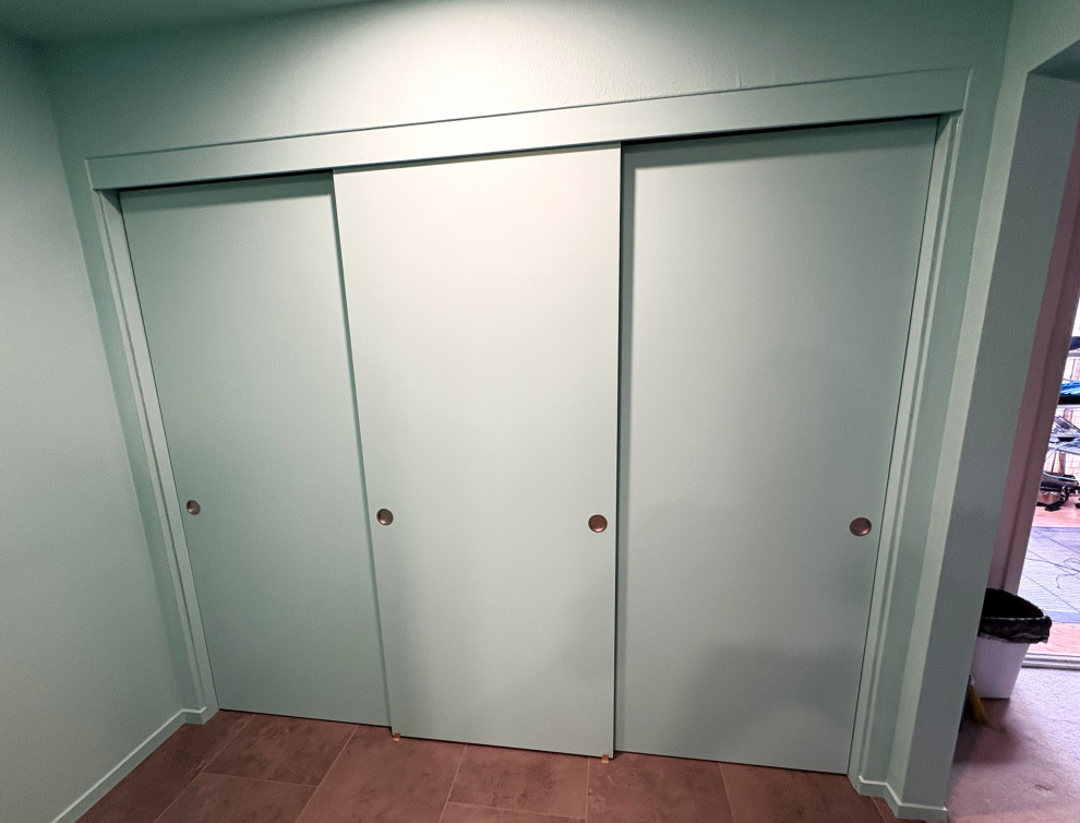 Example of a mid-sized transitional master green tile and ceramic tile vinyl floor, gray floor and double-sink freestanding bathtub design with shaker cabinets, light wood cabinets, a bidet, green walls, an undermount sink, quartzite countertops, a hinged shower door, white countertops and a built-in vanity