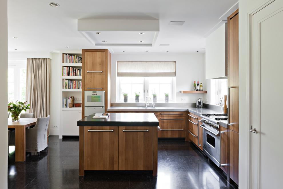 This is an example of a contemporary kitchen in New York with panelled appliances.
