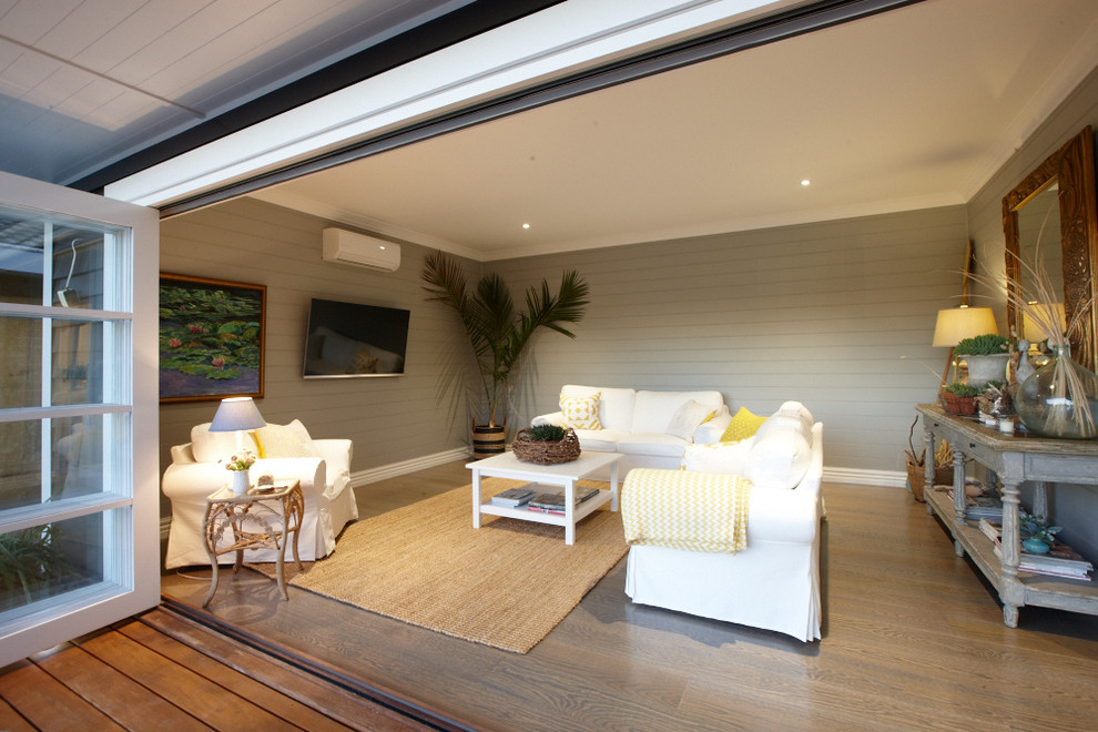 This is an example of a beach style family room in Melbourne.