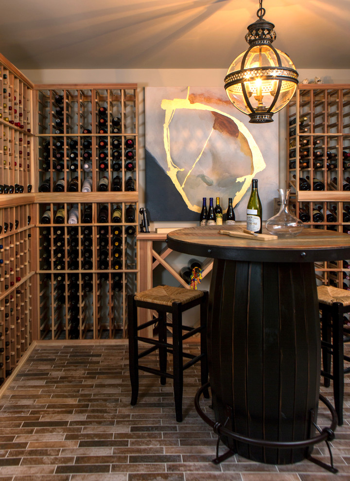 Design ideas for a small eclectic wine cellar in Nashville with brick floors, storage racks and brown floor.