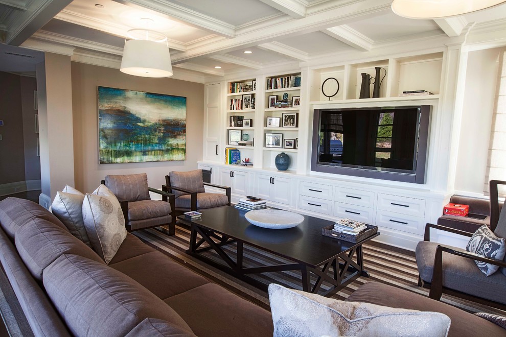 This is an example of a transitional family room in New York with beige walls and a built-in media wall.