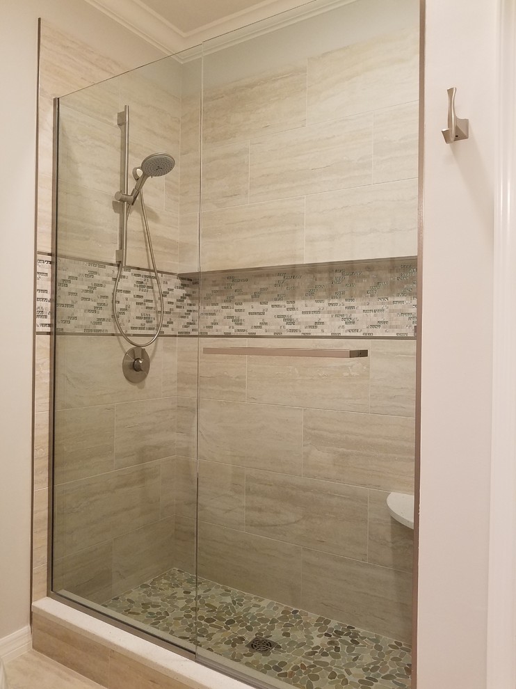 Alcove shower - small transitional 3/4 beige tile and porcelain tile ceramic tile alcove shower idea in Miami with a two-piece toilet, beige walls, a vessel sink and marble countertops