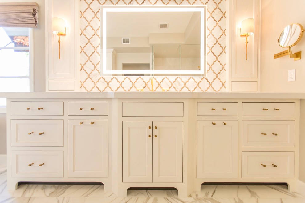 Freestanding bathtub - transitional master white tile and stone tile marble floor freestanding bathtub idea in Phoenix with recessed-panel cabinets, white cabinets, gray walls, an undermount sink and quartz countertops