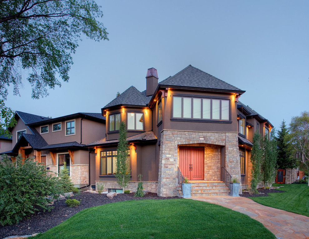 Design ideas for a traditional exterior in Calgary with stone veneer.
