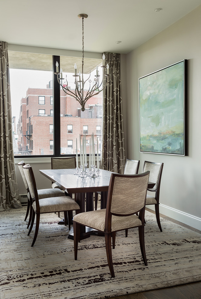 Example of a transitional dark wood floor dining room design in Boston with beige walls