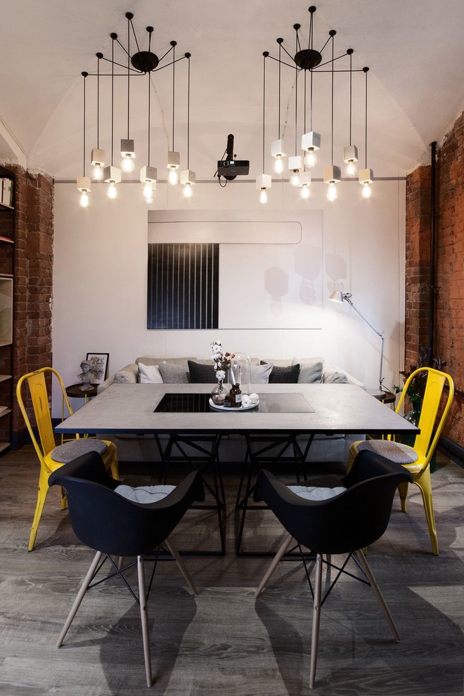 Industrial open plan dining in Saint Petersburg with white walls, dark hardwood floors and no fireplace.
