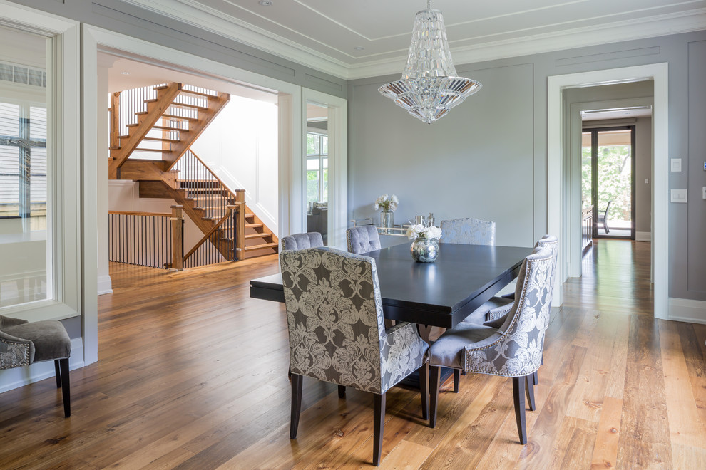 Large transitional separate dining room in Toronto with grey walls, medium hardwood floors and no fireplace.