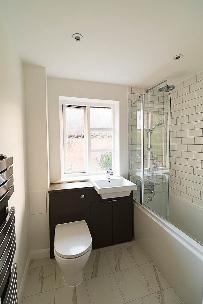 Design ideas for a small contemporary kids bathroom in Surrey with recessed-panel cabinets, grey cabinets, black and white tile, porcelain tile, white walls, porcelain floors and laminate benchtops.
