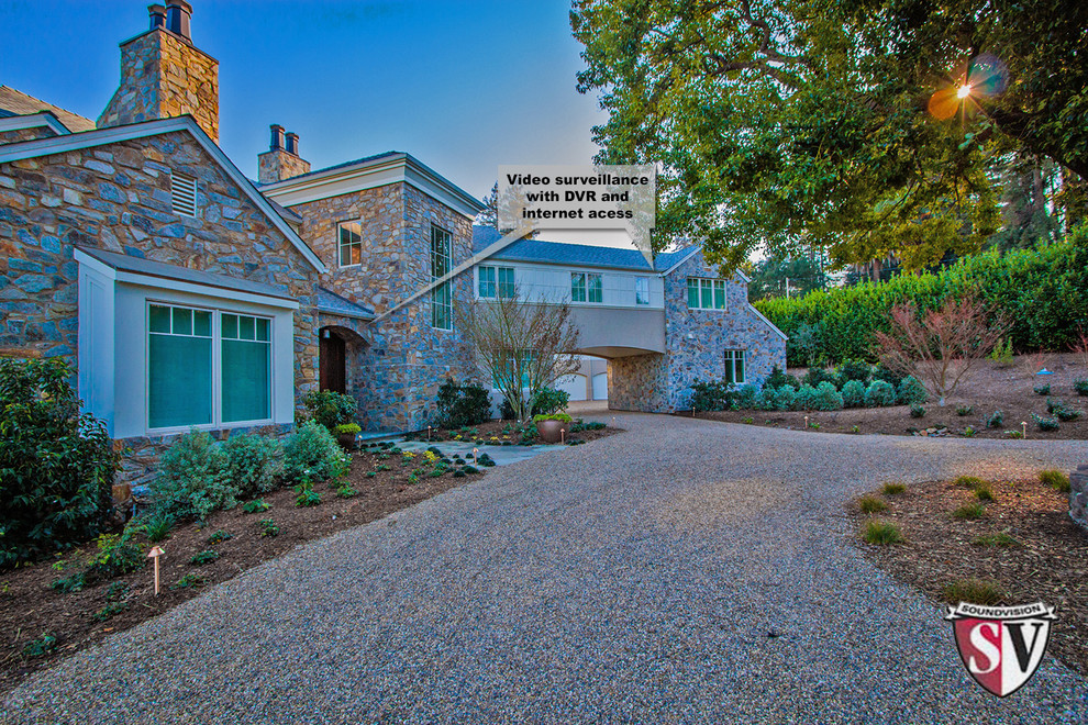 Huge traditional beige two-story stone exterior home idea in San Francisco