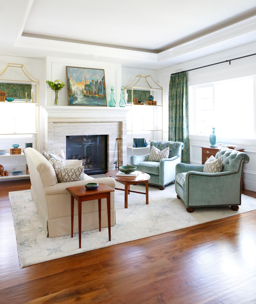 This is an example of a mid-sized transitional formal enclosed living room in Los Angeles with white walls, a standard fireplace, carpet, a plaster fireplace surround, a built-in media wall and multi-coloured floor.