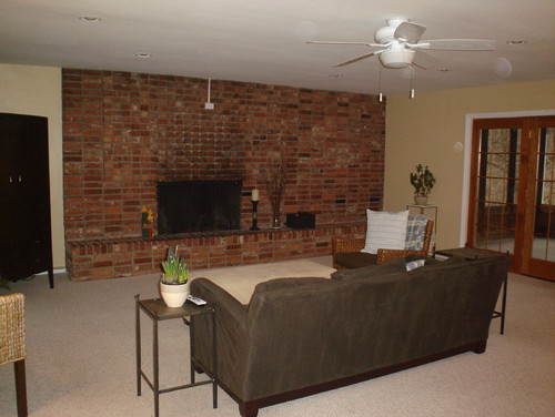 I would love some advice on how to approach this large brick wall/fireplace.  I know it can be a great asset