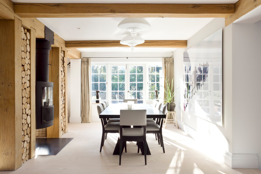 Photo of a large scandinavian kitchen/dining combo in Surrey with light hardwood floors.