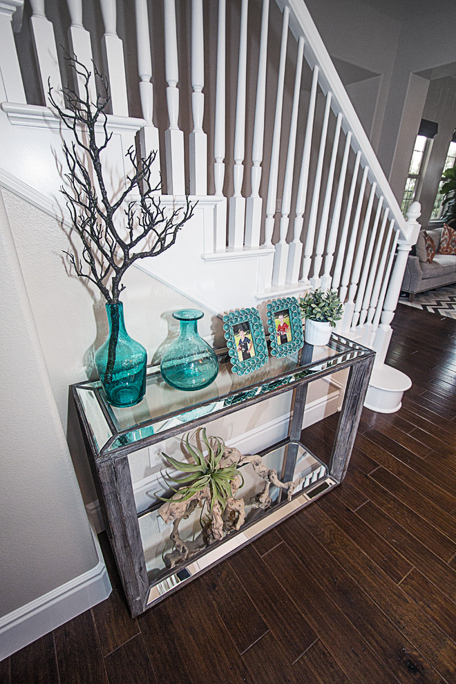 Mid-sized transitional dark wood floor hallway photo in Orange County with beige walls