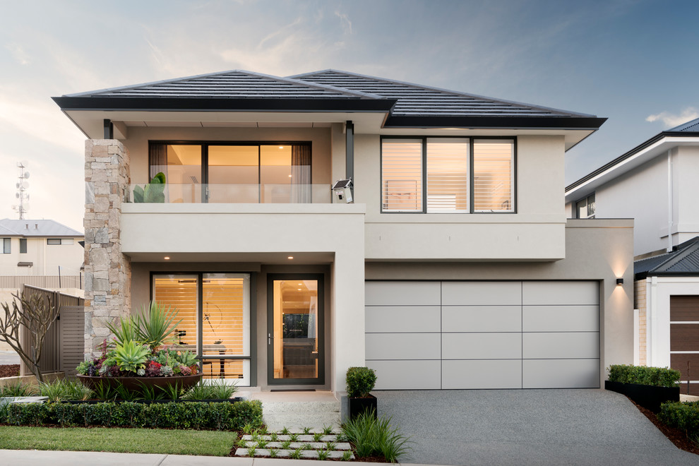 Inspiration for a contemporary two-storey stucco beige house exterior in Perth with a hip roof.