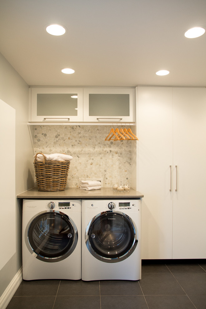 Design ideas for a contemporary laundry room in Tampa with white cabinets.
