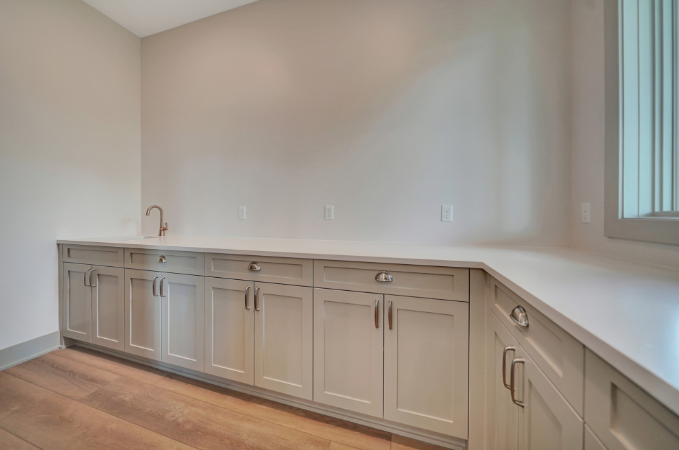Transitional laundry room photo in Omaha