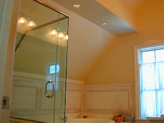 Example of a mid-sized transitional master corner shower design in Boston with beige walls