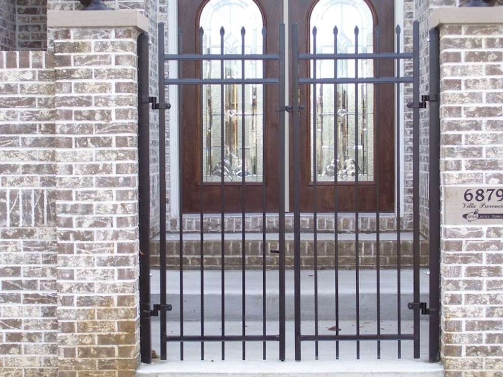 Small elegant front door photo in Indianapolis with a medium wood front door