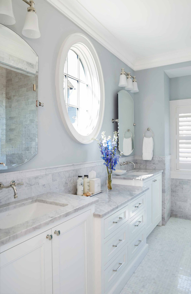 Inspiration for a mid-sized beach style master bathroom in New York with white cabinets, an undermount sink and a single vanity.