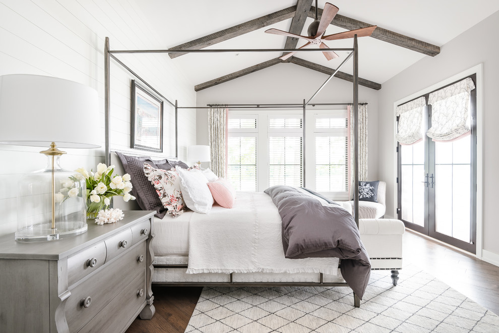 Farmhouse master dark wood floor and brown floor bedroom photo in Columbus with gray walls