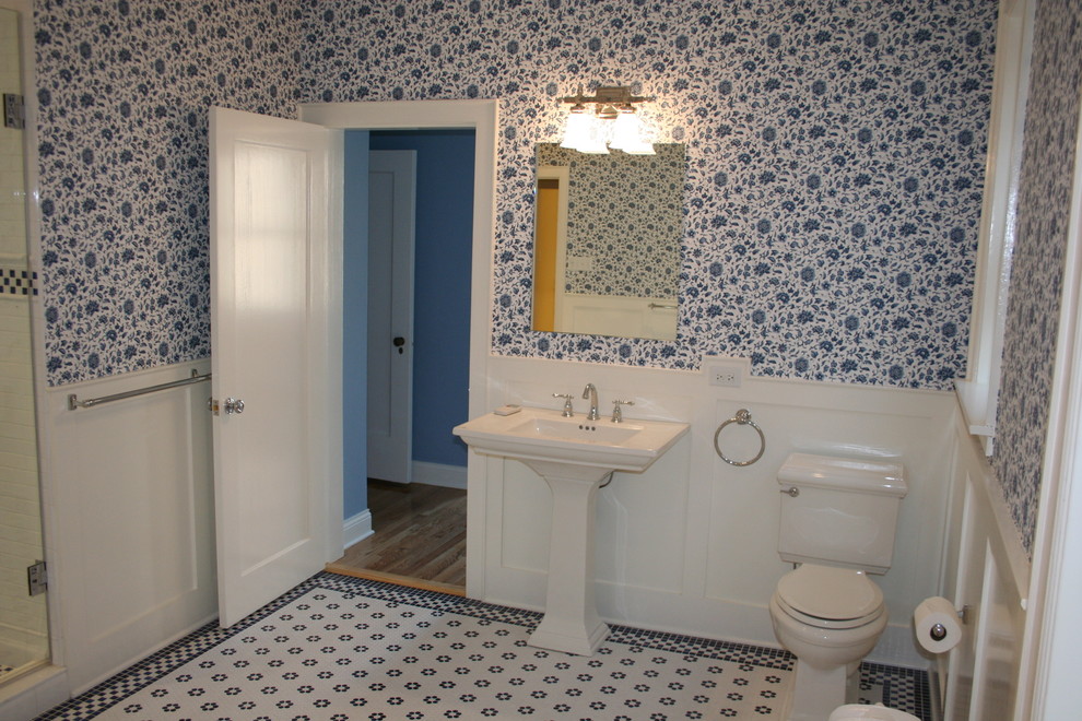 Design ideas for a large traditional master bathroom in Chicago with a claw-foot tub, an alcove shower, a two-piece toilet, blue tile, ceramic tile, blue walls, ceramic floors and a pedestal sink.