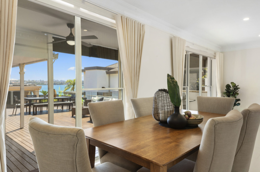 Design ideas for a mid-sized contemporary open plan dining in Sydney with white walls, ceramic floors and white floor.