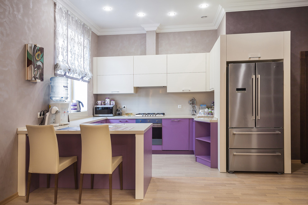 Design ideas for a large eclectic u-shaped eat-in kitchen in Other with purple cabinets, beige splashback, laminate floors and beige benchtop.