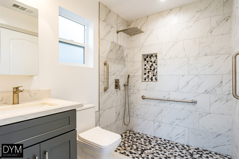 Medium sized contemporary shower room bathroom in Los Angeles with shaker cabinets, grey cabinets, a walk-in shower, a one-piece toilet, white tiles, marble tiles, white walls, marble flooring, a built-in sink, marble worktops, white floors, an open shower, white worktops, a single sink, a built in vanity unit, a wallpapered ceiling and wallpapered walls.