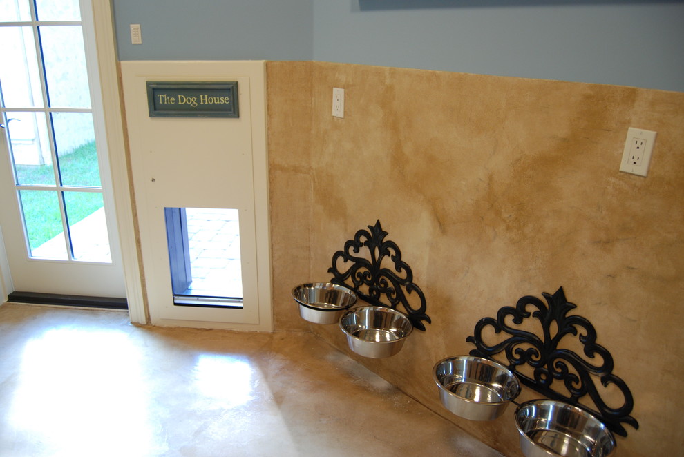Example of a tuscan laundry room design in Jacksonville with blue walls