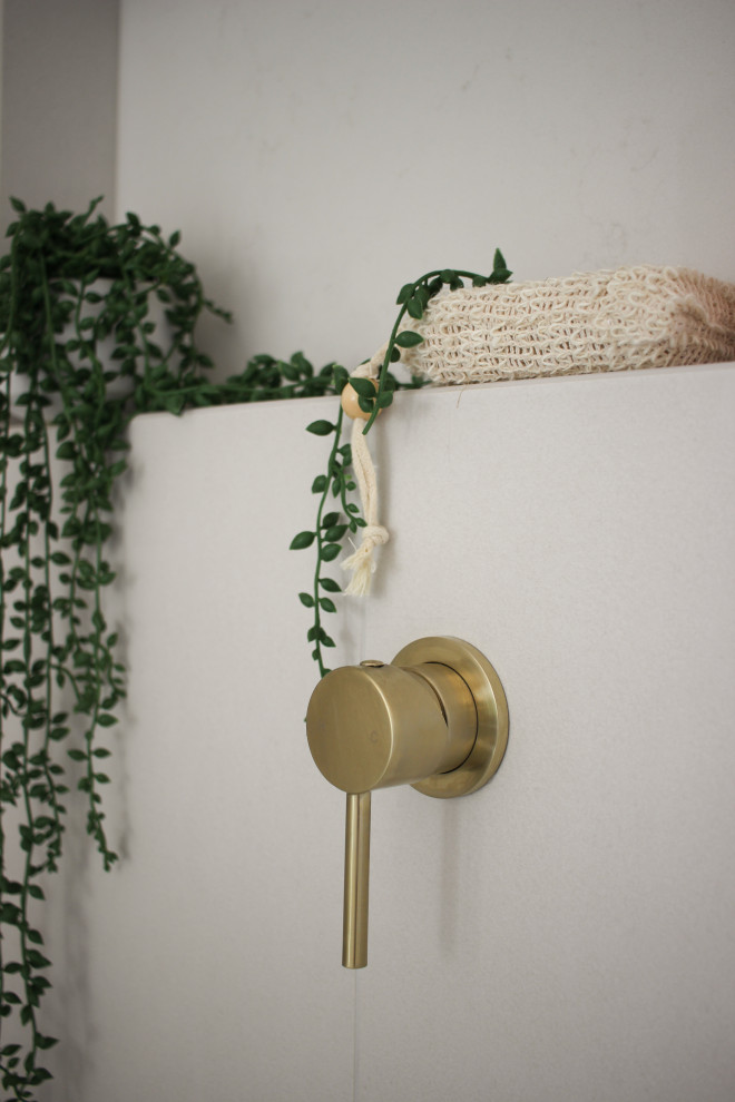 Inspiration for a mid-sized contemporary master bathroom in Sydney with light wood cabinets, a freestanding tub, an open shower, a two-piece toilet, white tile, ceramic tile, porcelain floors, a vessel sink, engineered quartz benchtops, grey floor, an open shower, white benchtops, a niche, a double vanity and a floating vanity.