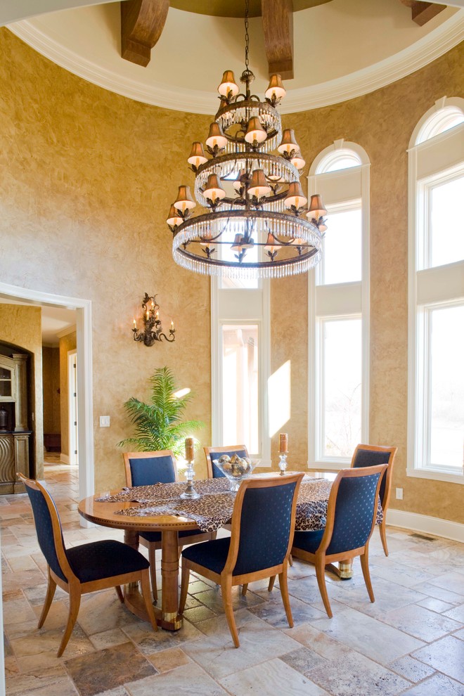 Inspiration for a large mediterranean separate dining room in Indianapolis with multi-coloured walls, travertine floors and no fireplace.