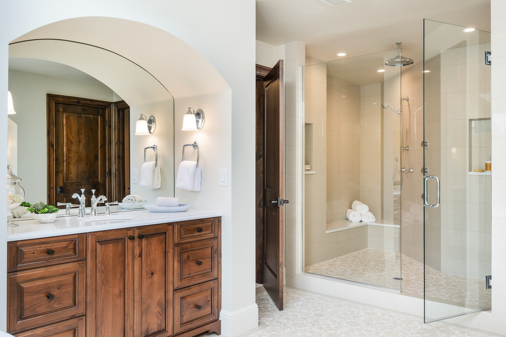 Inspiration for a traditional bathroom in Seattle with raised-panel cabinets.