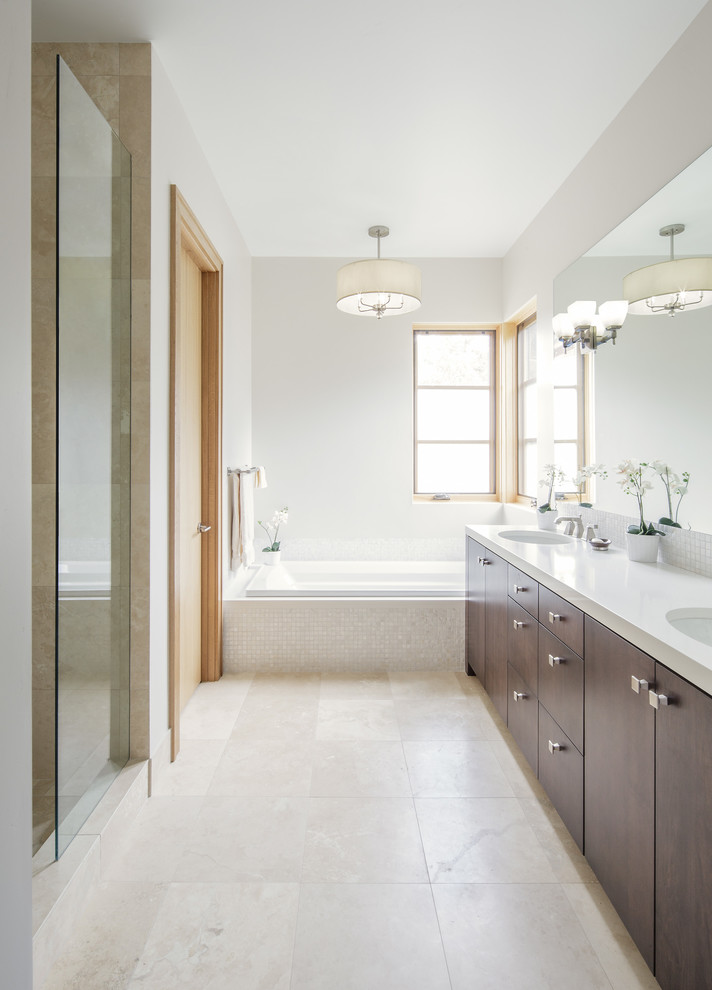 This is an example of a contemporary master bathroom in Denver with an undermount sink, flat-panel cabinets, dark wood cabinets, an alcove tub, an alcove shower, white tile, mosaic tile and grey walls.
