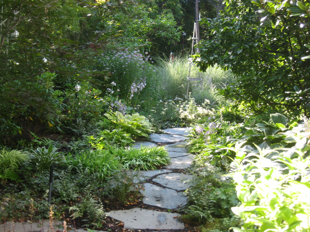 Photo of a small eclectic side yard shaded garden for summer in Boston with a garden path and natural stone pavers.